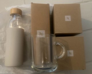 Confezione Bottiglia e Tazze Nespresso Mai Usate