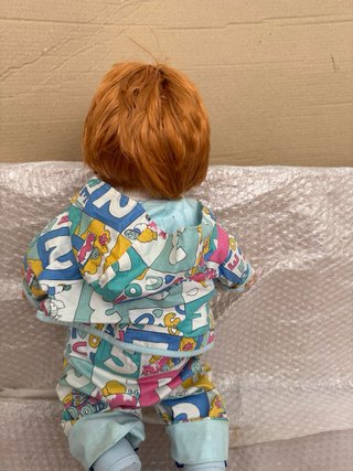 muñeco baby feber , el cuerpo de tela, mide 50 cm