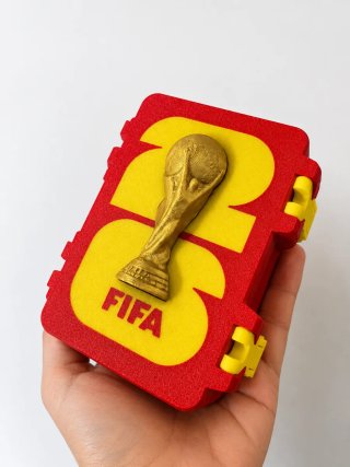Caja cromos Mundial FIFA 2026 con trofeo 3D