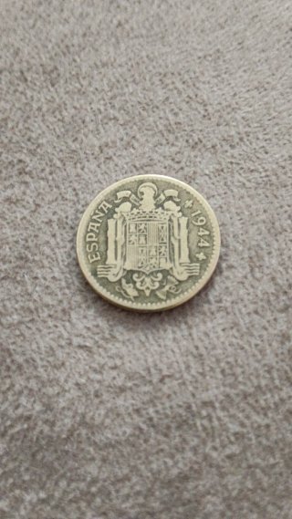 Moneda 25 cts con agujero y pesetas 1944