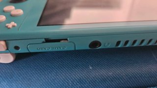Nintendo Switch Lite Turchese + Custodia + Gioco