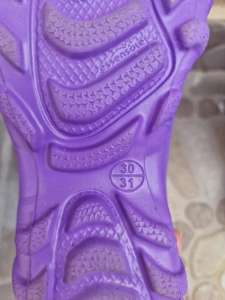 Botas de agua Quechua moradas
