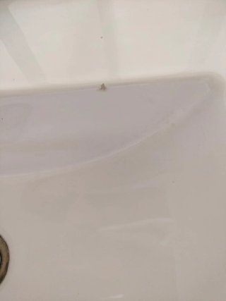 Lavabo de cerámica con mueble y griferia