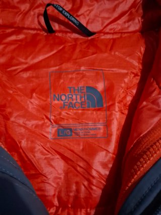 Chaqueta The North Face gris y naranja