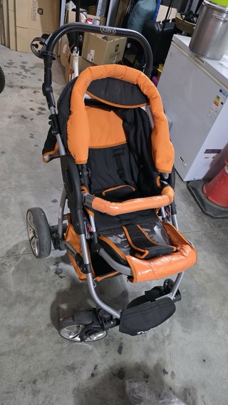 Carrito de bebé Graco naranja y negro