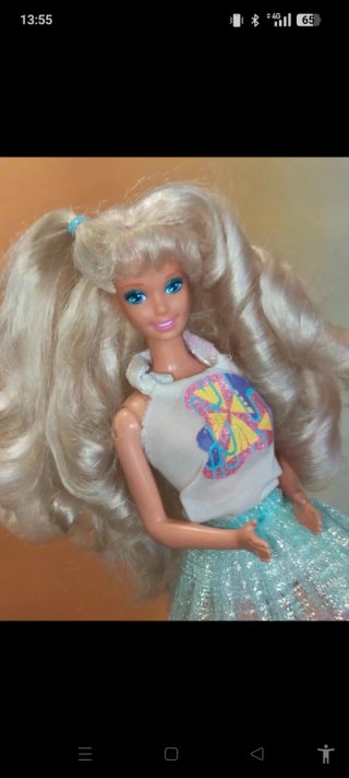 Bambola Barbie con gonna glitterata