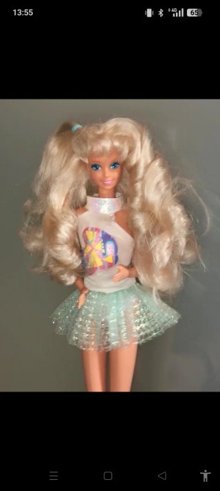 Bambola Barbie con gonna glitterata