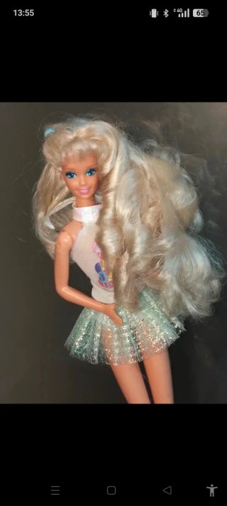 Bambola Barbie con gonna glitterata