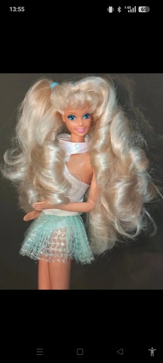 Bambola Barbie con gonna glitterata