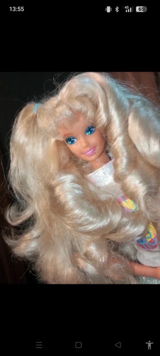Bambola Barbie con gonna glitterata