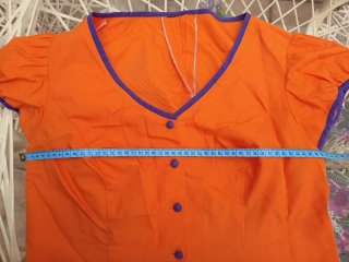 Traje de flamenca naranja y morado