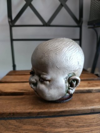 Cabeza de muñeco antigua de níquel
