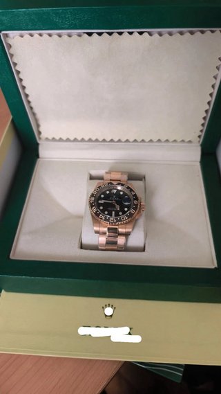 Reloj Rolex Dorado y Negro