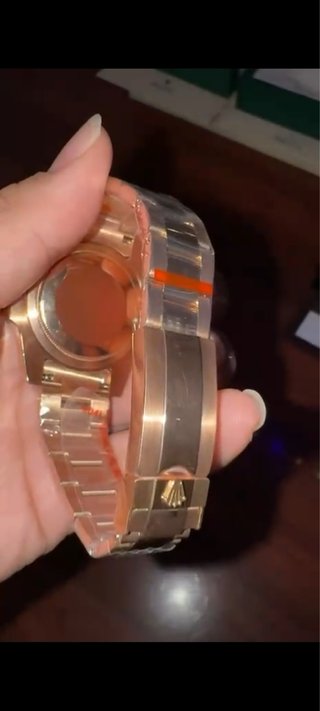 Reloj Rolex Dorado y Negro