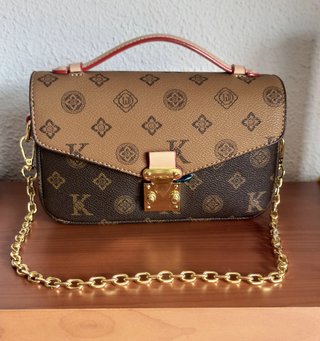 Bolso bandolera marrón y dorado nuevo.