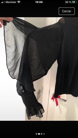 Jersey cuello alto mangas transparentes