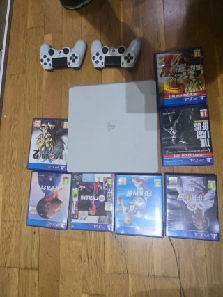 PS4 Slim Blanca + 2 Mandos + 7 Juegos
