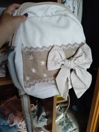Mochila bebé beige y estrellas