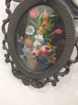 Cornicetta in metallo con fiori