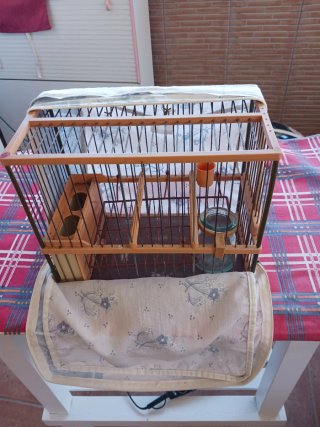 Jaula para pájaros con fundas de tela