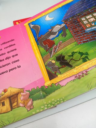 2 libros de cuentos con 5 puzles cada uno.