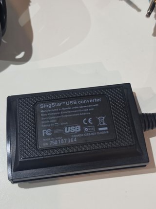 2 Micrófonos Singstar + Adaptador