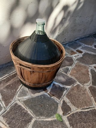 Damigiana in vetro con cestello