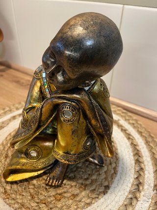Figura decorativa oriental estilo buda