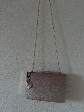Bolso de fiesta dorado con purpurina