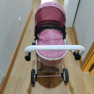 Cochecito de muñecas rosa con capota.perfecto.
