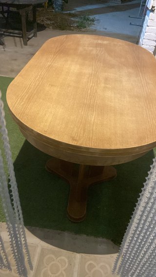 Mesa de comedor redonda de madera extensible