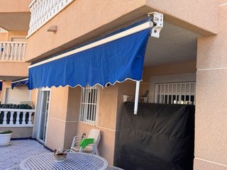 Toldo extensible brazo articulado azul