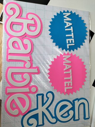 ENCARGO DE MARIA logo Barbie y mattel
