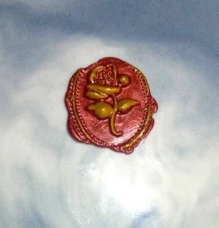 Sello de lacre hecho a mano con rosa