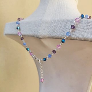 Collana con ciondolo sferico argentato