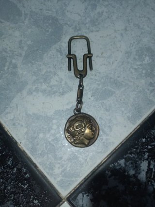 Llavero antiguo con cabeza de hombre