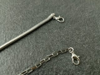 Coppia braccialetti acciaio con charms