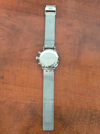 Reloj Calvin Klein plateado y blanco