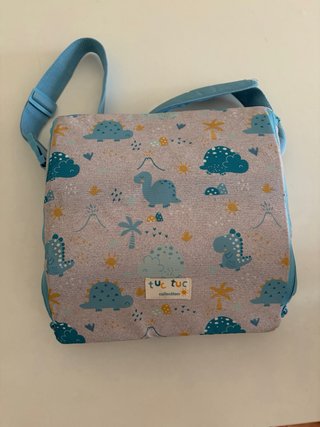 Asiento elevador infantil marca tuctuc almacenaje