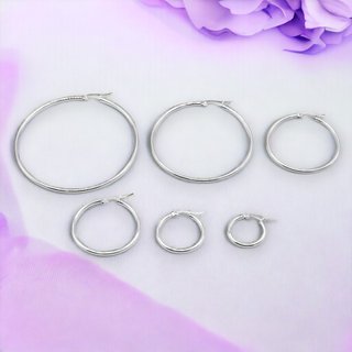 Aros 5 cm. diámetro plateados o dorados de acero.
