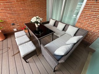 Conjunto de jardín ratán y mesa de cristal