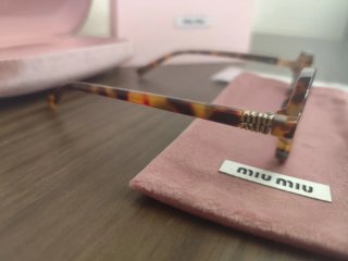 Occhiali da sole Miu Miu tartarugati con Lenti Ros