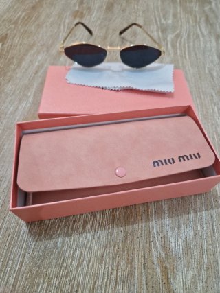 Occhiali da sole Miu Miu oro e nero