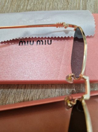 Occhiali da sole Miu Miu oro e nero