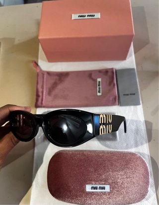 Occhiali da sole Miu Miu neri e oro