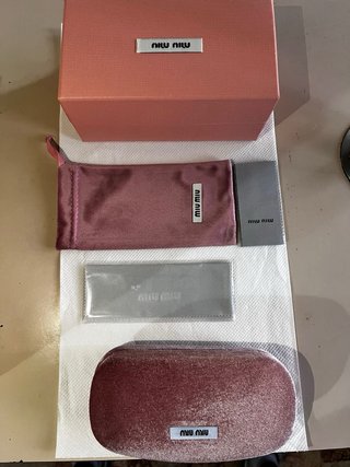Occhiali da sole Miu Miu neri e oro