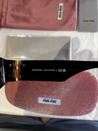 Occhiali da sole Miu Miu neri e oro
