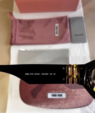 Occhiali da sole Miu Miu neri e oro