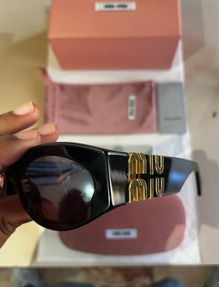 Occhiali da sole Miu Miu neri e oro