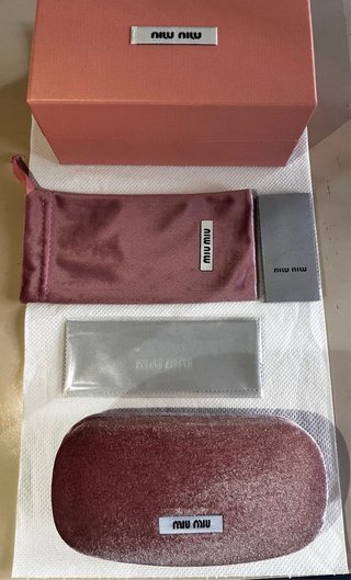 Occhiali da sole Miu Miu neri e oro